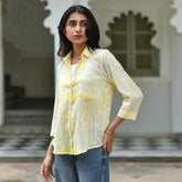 Brighten your wardrobe with Zesty by The Sootee — a hand-dyed Shibori shirt in radiant yellow on soft mulmul cotton. With its relaxed fit, shell buttons, and airy silhouette, this sustainable fashion piece brings artisanal charm and slow fashion sensibility to everyday wear.