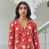 Discover Gulnaar by The Sootee — a red hand block printed cotton top with white floral motifs, a flattering V-neckline, and three-quarter sleeves. Crafted for breathable comfort and timeless style, this sustainable piece pairs artisan heritage with effortless everyday elegance.