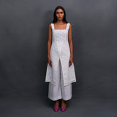 Embrace timeless elegance with Snowdrop by The Sootee — a handcrafted white Schiffli cotton co-ord set featuring floral cutwork, a sleeveless overlay top, and wide-legged pants. Versatile, breathable, and sustainably made, it’s perfect for slow-fashion lovers seeking effortless sophistication.