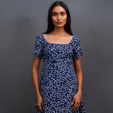 Meet Iris by The Sootee — a handcrafted Indigo cotton A-line dress featuring elegant hand block prints, a round neckline, and back tie-up detail. Fully lined and designed with hidden pockets, this sustainable slow-fashion piece blends comfort, heritage craft, and effortless everyday style.