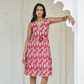 Discover Palasha by The Sootee — a rust red Bagru hand block print cotton dress with a detachable belt and handmade wooden buckle. Sleeveless, V-neck, and pocketed, this artisan-crafted slow-fashion piece blends traditional elegance with modern versatility.