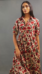 Discover Amaya by The Sootee — a flowing Bagru hand block print cotton dress with a collared tiered A-line silhouette, puffed half sleeves, and earthy floral motifs. Lightweight and breathable, this sustainable slow-fashion piece blends heritage craft with effortless elegance.