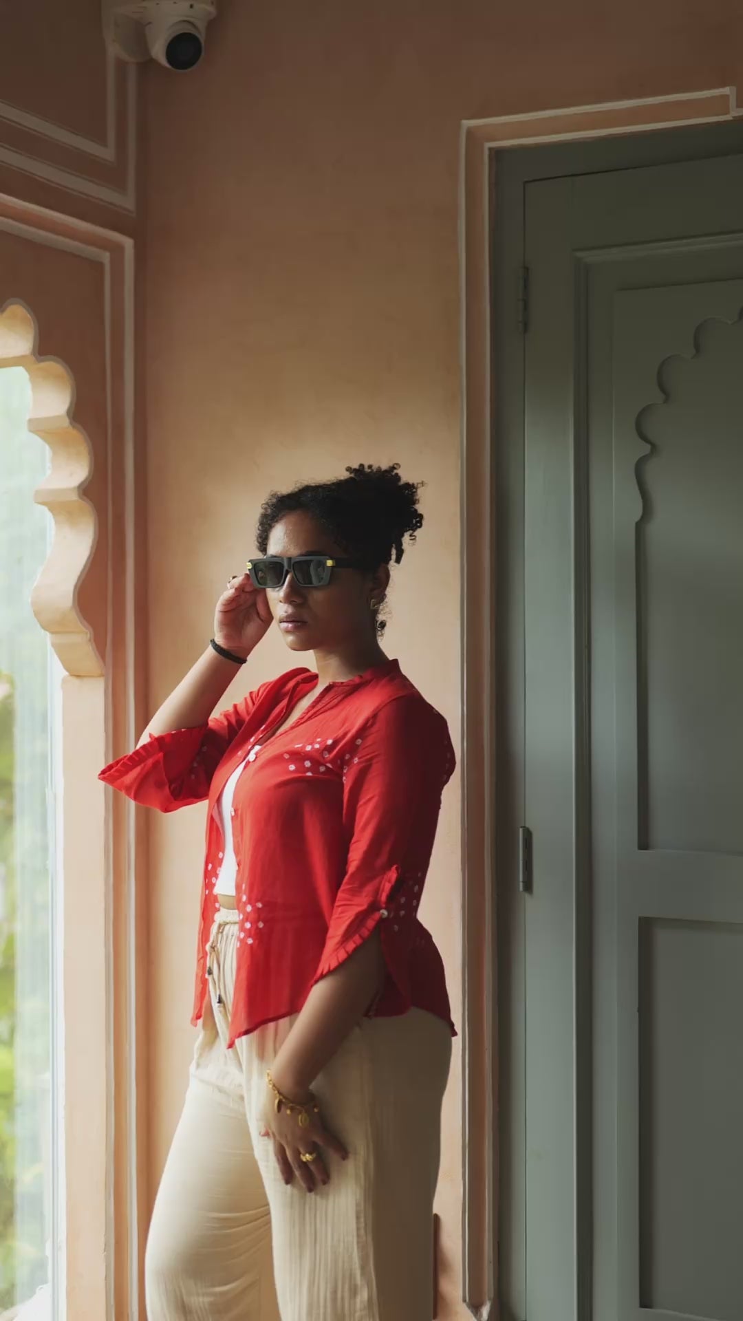 Discover Leher by The Sootee — a breezy Bandhani mulmul cotton shirt in deep red with white hand-tied motifs. Featuring 3/4th frill sleeves and a relaxed fit, this sustainable slow-fashion piece blends timeless craft with everyday chic, perfect for versatile styling.